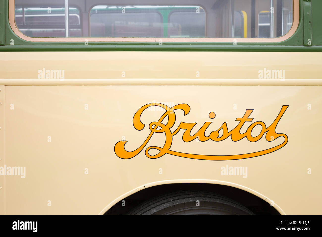 The 1950s/1960s Bristol Bus logo in yellow on a cream vintage bus. Stock Photo