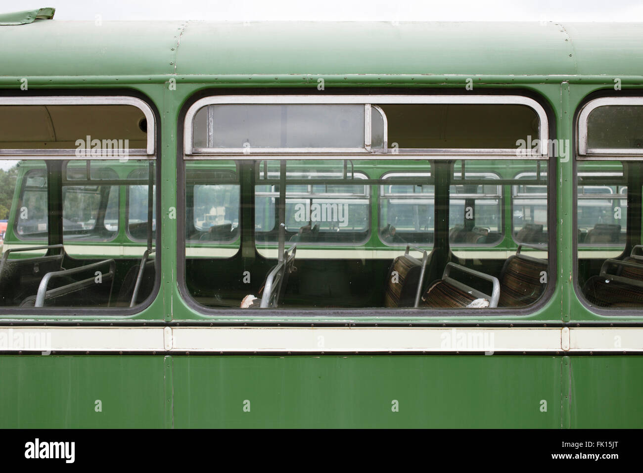 Rows of windows of restored green vintage 1950s Bristol buses at the Annual Vintage Bus Rally in Bristol. Stock Photo