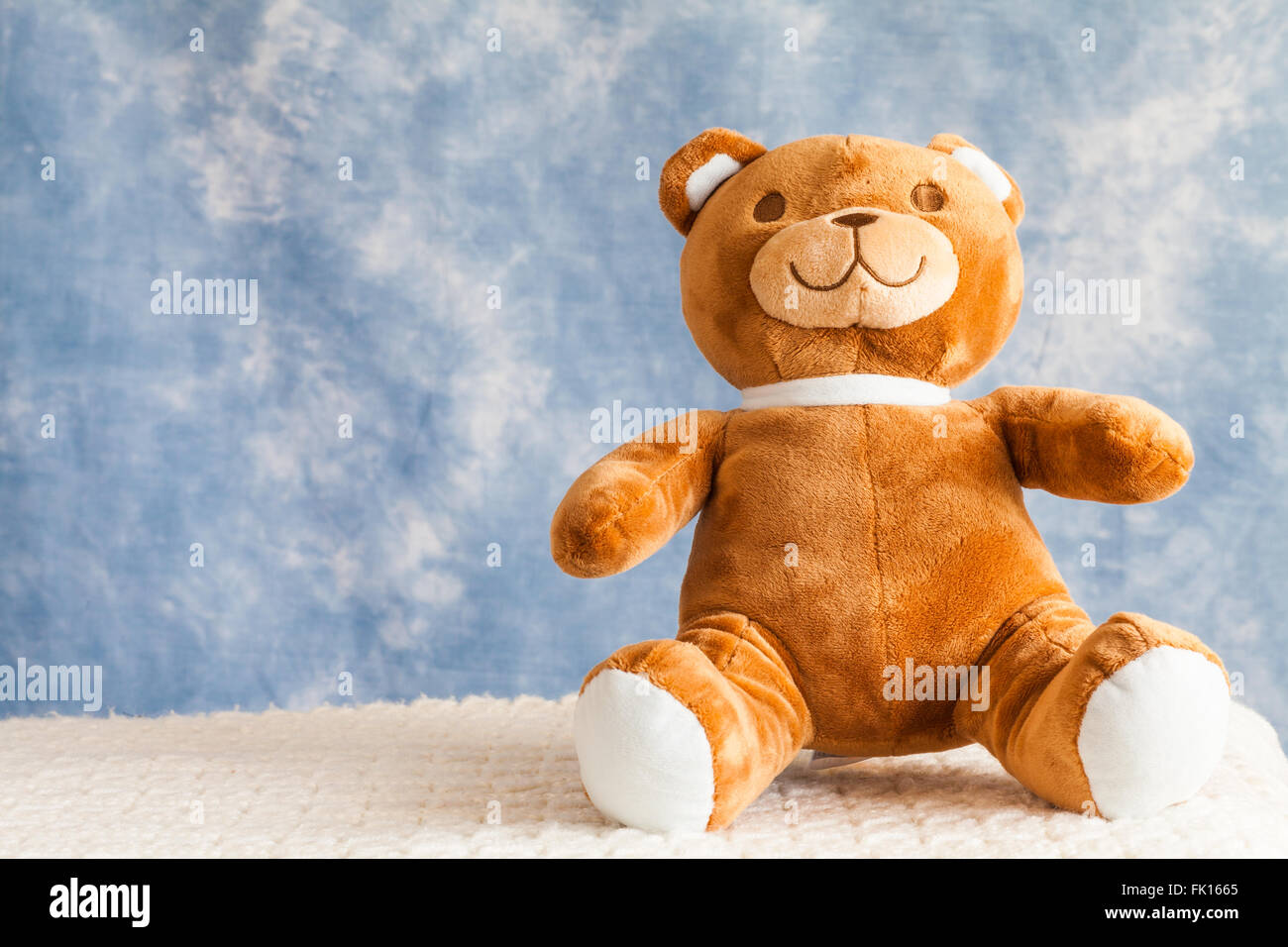Teddy Bear toy on blue sky background with copyspace Stock Photo - Alamy