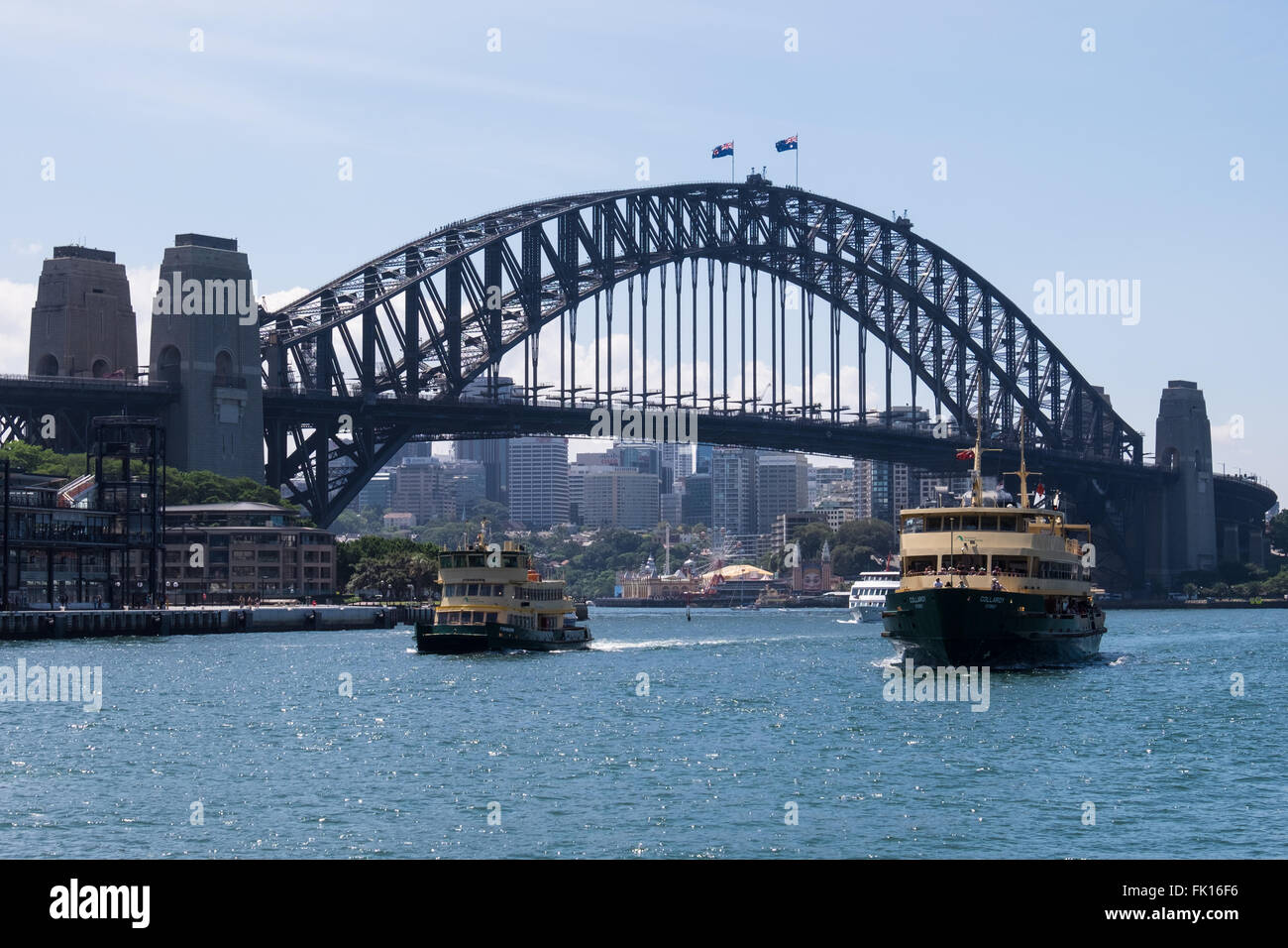 Sydney Harbour Ferries Fishburn (left) and Collaroy (right) returning into Sydney Cove, with the Sydney Harbour Bridge as a backdrop. Stock Photo