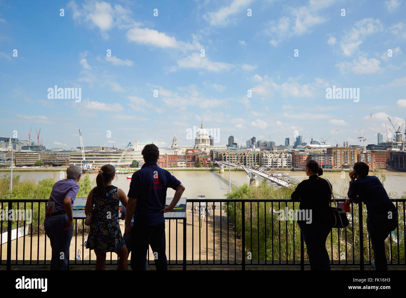 People looking at cityscape from Tate Modern terrace in a sunny summer day in London Stock Photo