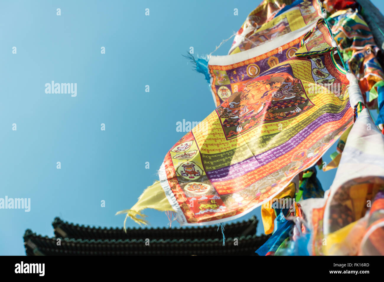 Buddhist texts on Tibetan flags before a China temple Stock Photo