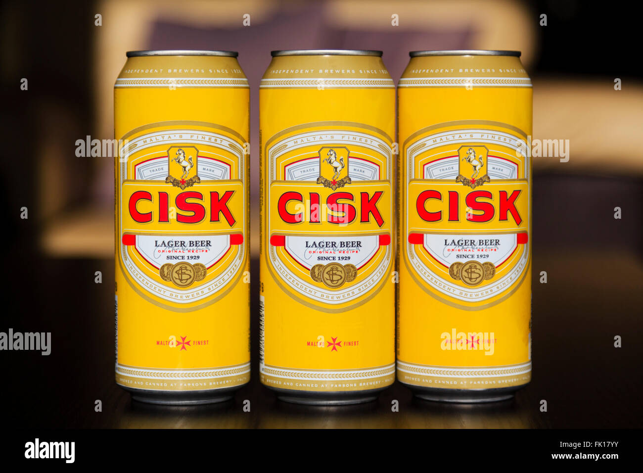 3 tins of Maltese brewed Cisk lager. Stock Photo