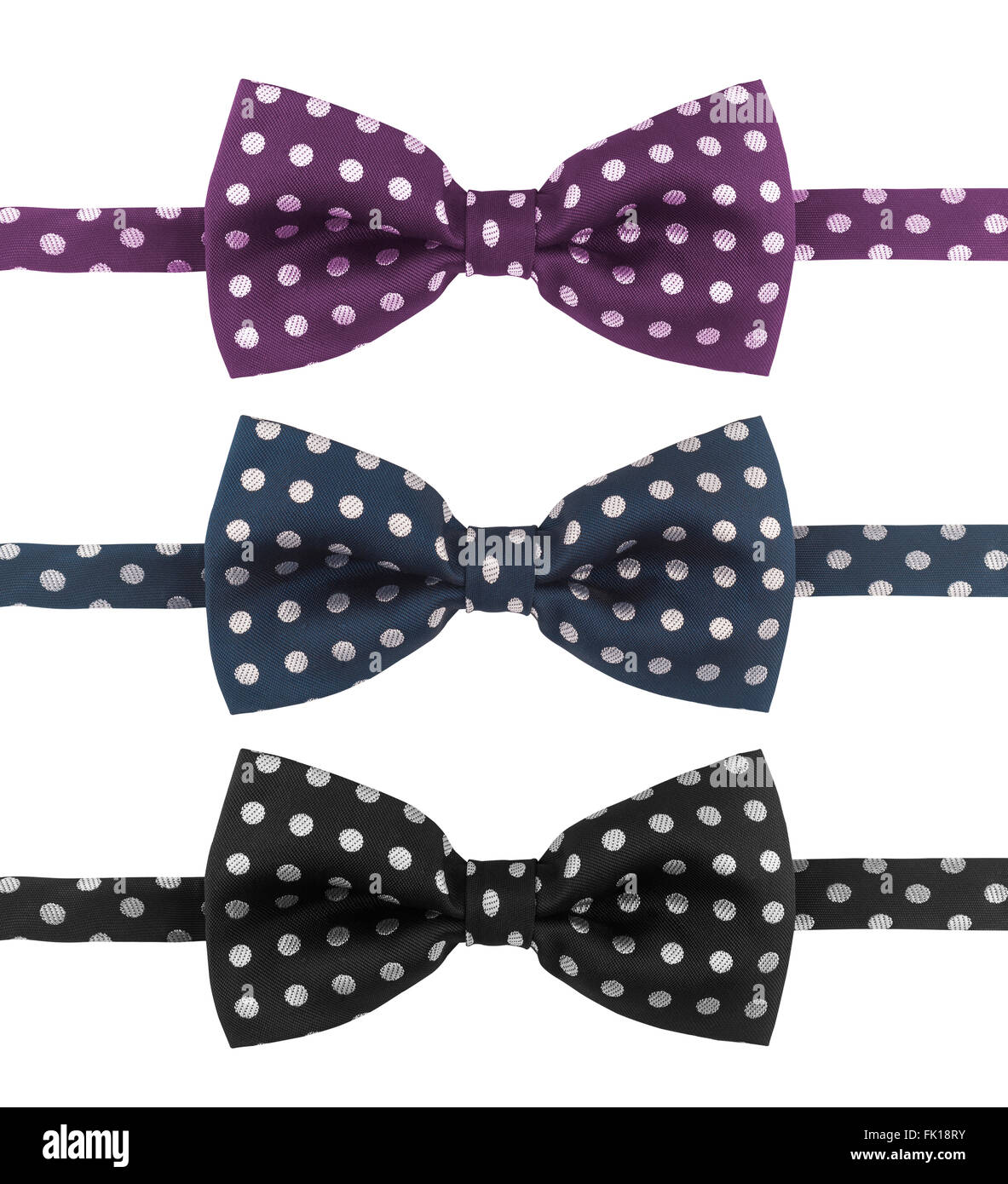 Three dotted tie bows in different colors isolated on white background Stock Photo