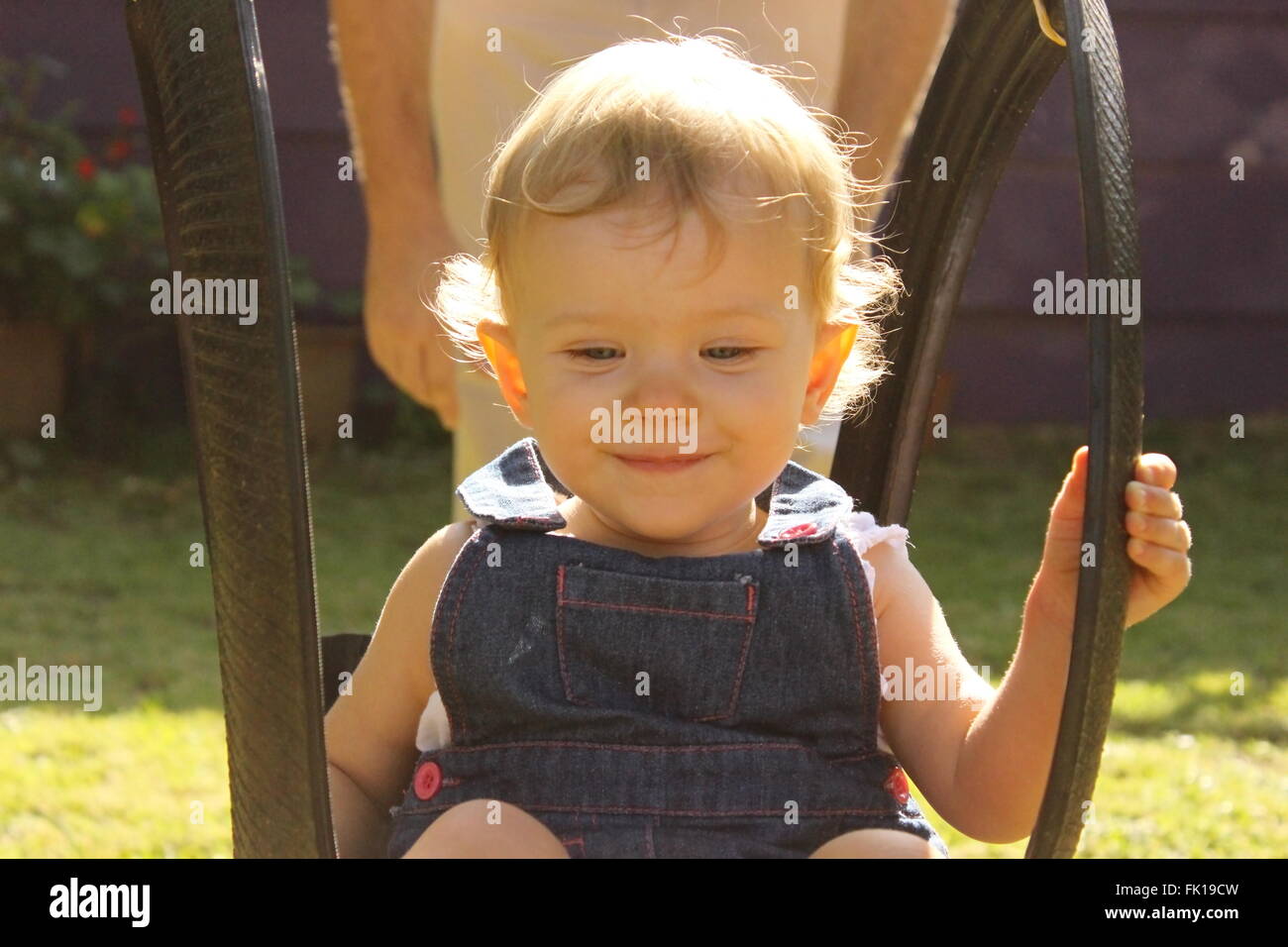 baby girl on a swing Stock Photo Alamy