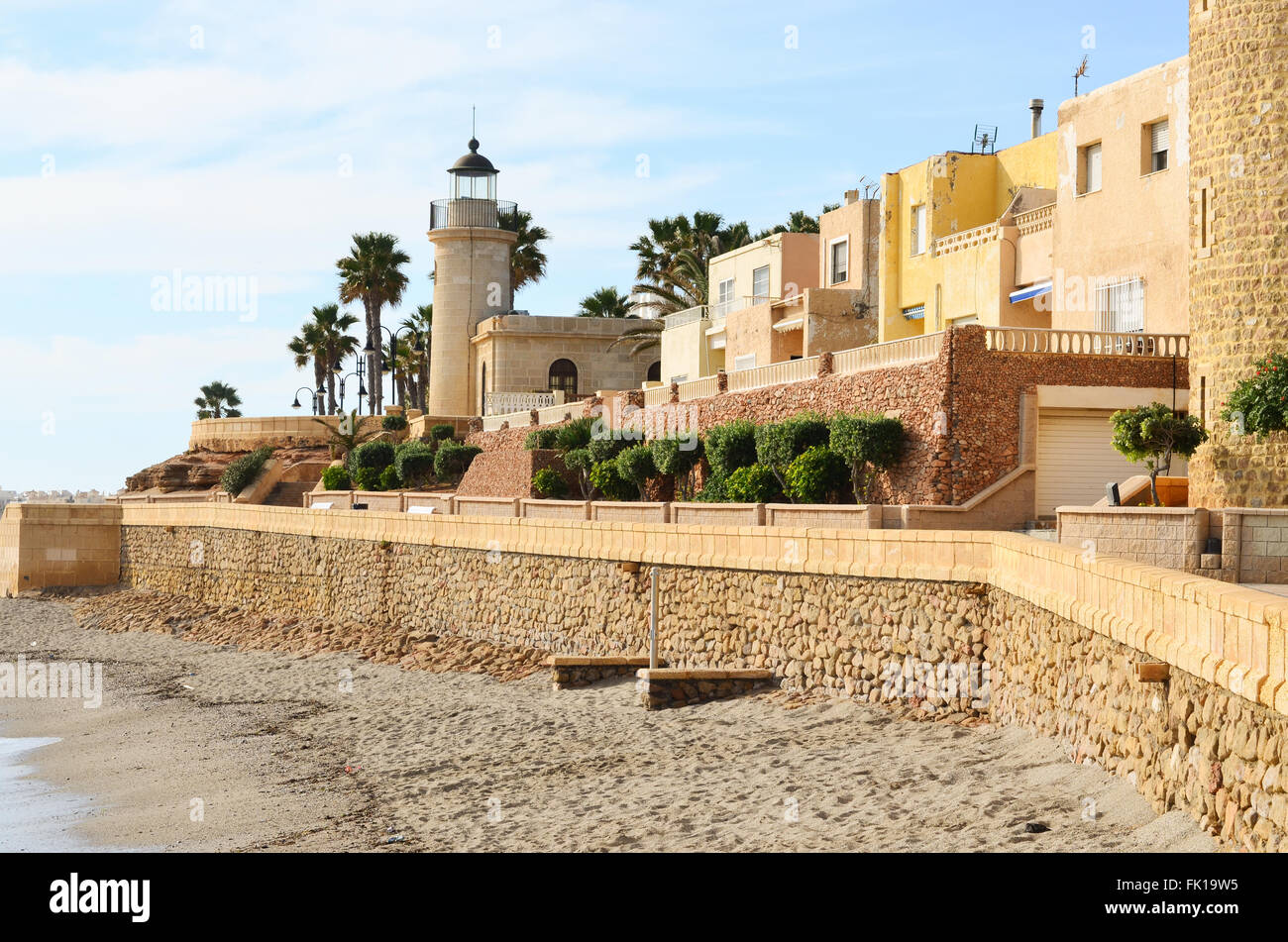 Seafront at Roquetas de Mar with villas and lighthouse at Castillo de
