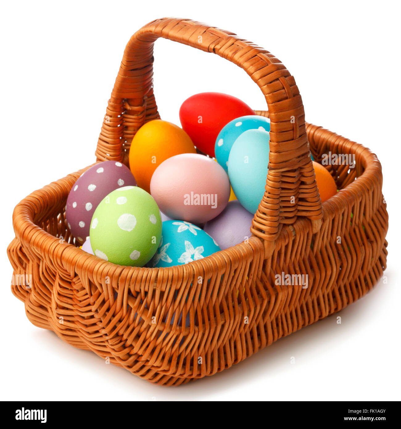 Easter eggs in basket isolated on white background Stock Photo - Alamy