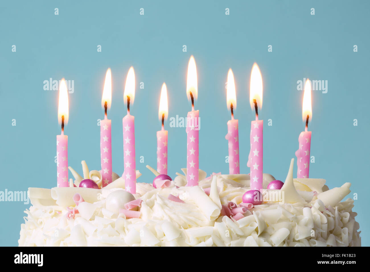 Birthday cake with pink candles Stock Photo - Alamy