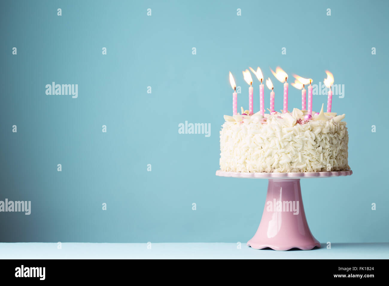 Birthday cake with pink candles Stock Photo - Alamy