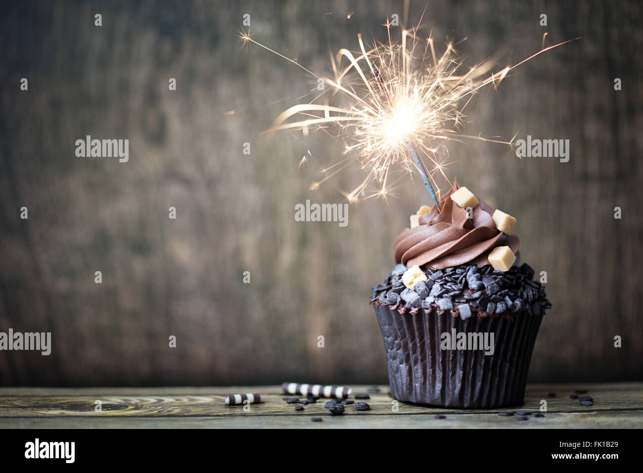 Chocolate cupcake with a sparkler Stock Photo