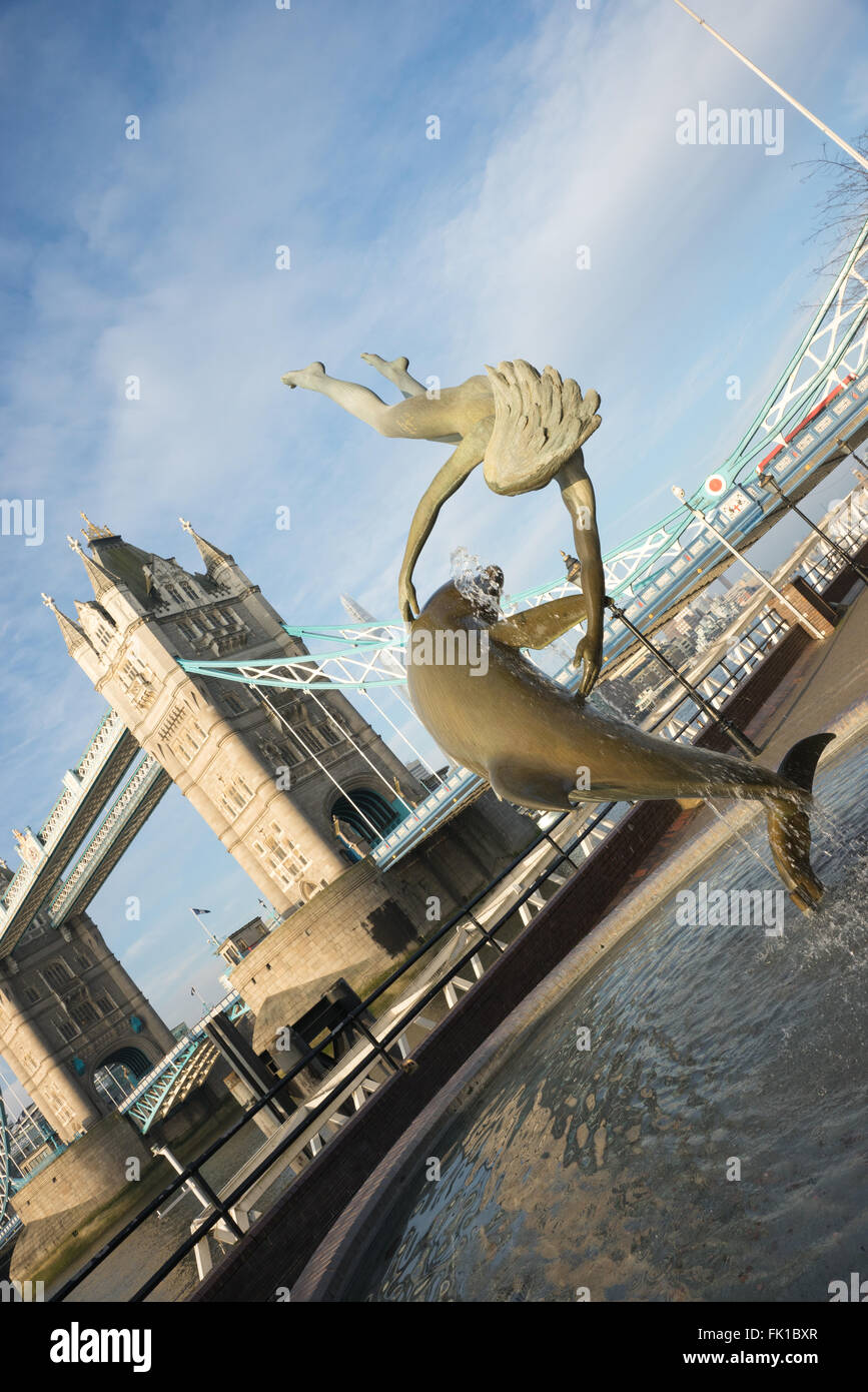 Girl with a Dolphin near Tower Bridge Stock Photo