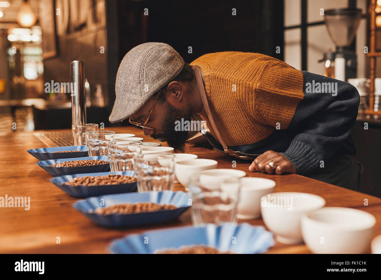 African man at a coffee tasting taking the aroma Stock Photo