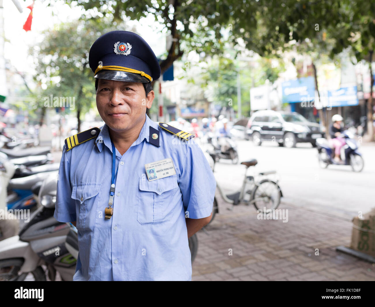 Security guard on the streets of Hanoi, Vietnam Stock Photo Alamy