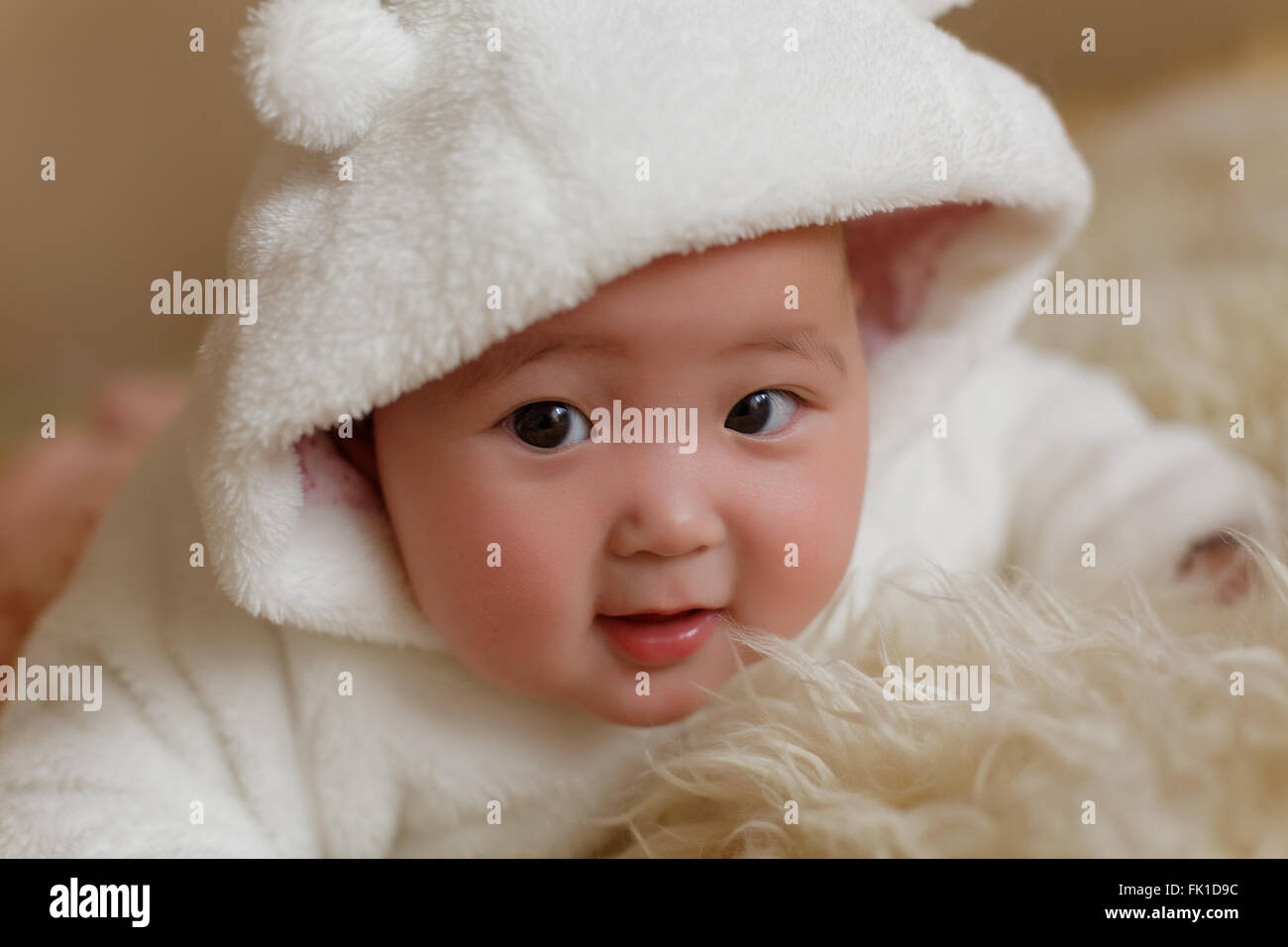 pretty little baby girl in white fur coat Stock Photo Alamy