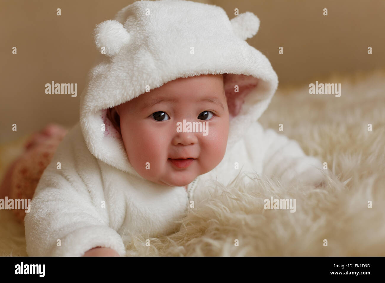 pretty little baby girl in white fur coat Stock Photo Alamy