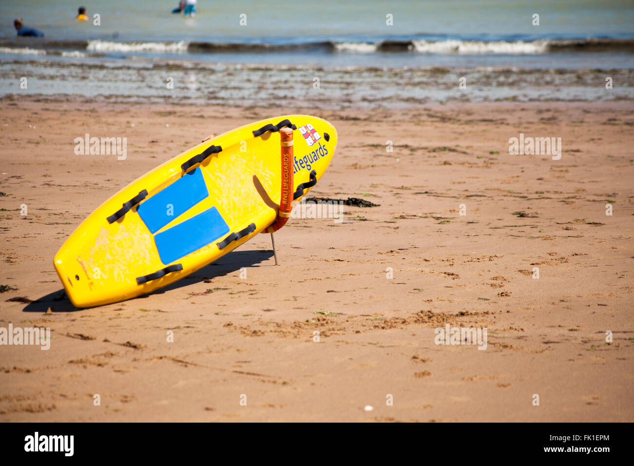 Lifeguards Surf / body board on a beach at Joss Bay, Kent, England