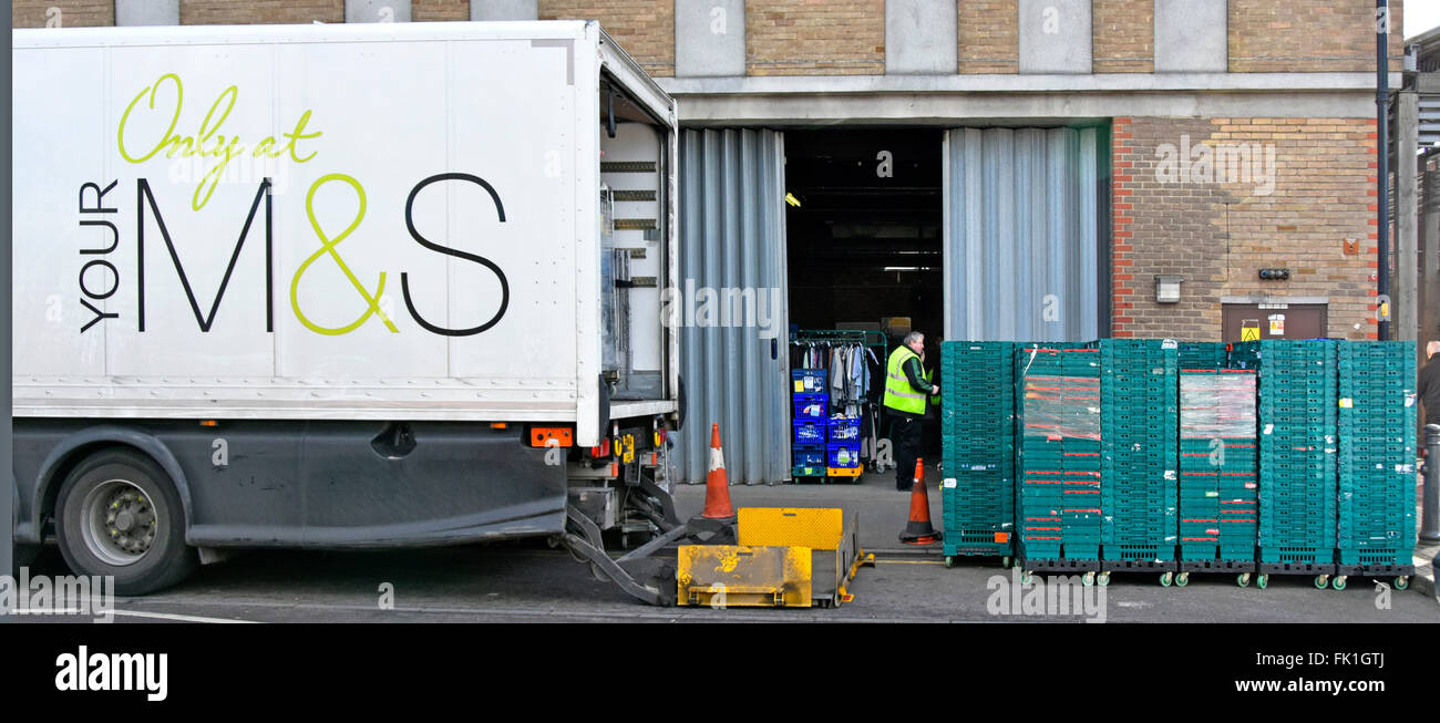 Back of articulated M&S lorry tailgate lift & new delivery of merchandise stacked rear of high street store to complete the supply chain England UK Stock Photo