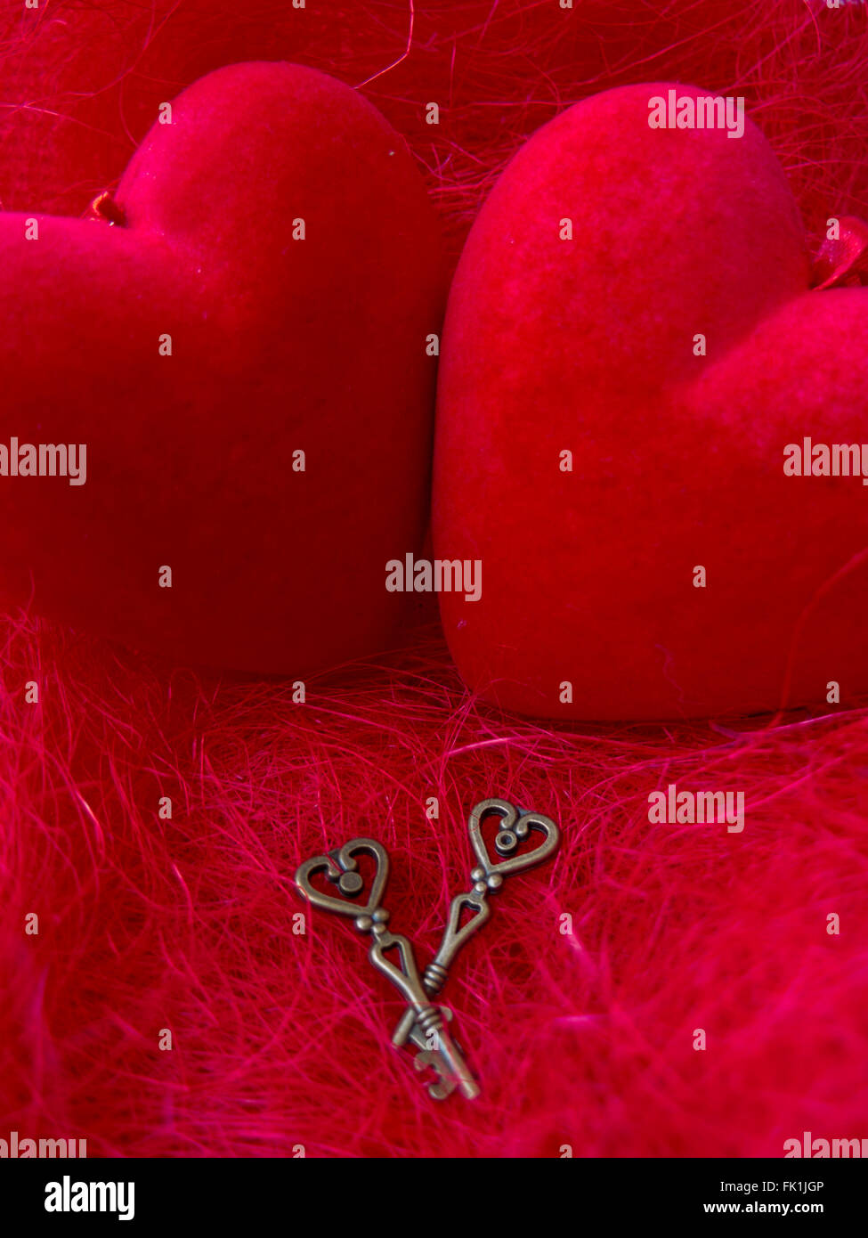 Two red hearts with two keys on a red background scenery Stock Photo ...