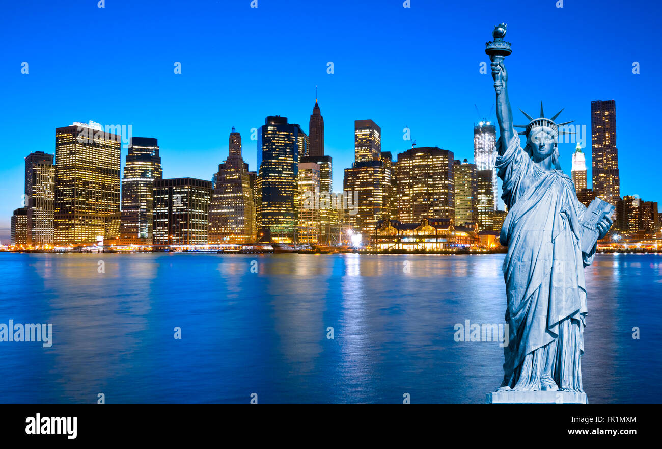 Manhattan Skyline and The Statue of Liberty at Night, New York City Stock Photo