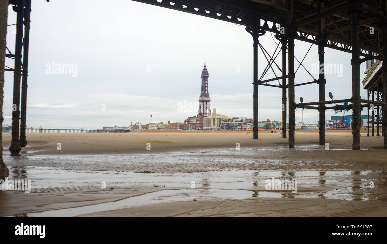 Central Pier, Blackpool.  Taken from underneath to show the structural build.  Blackpool Tower can be seen. Stock Photo