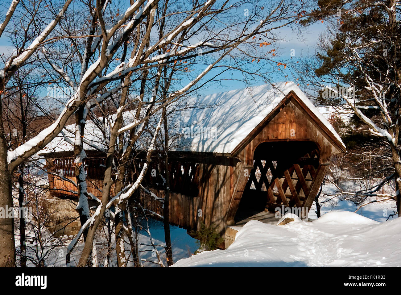 Old covered bridge in New Hampshire after snowfall provides access ...