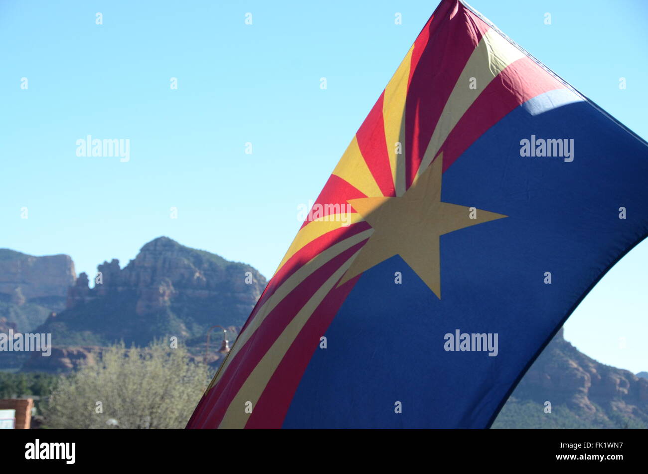 arizona state flag flying sedona blue sky red rocks Stock Photo - Alamy
