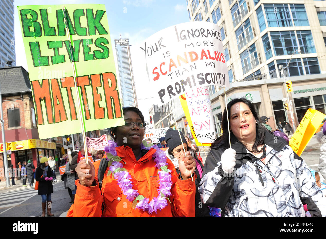 Toronto, Canada. March 5, 2016. International Women's Day Toronto 2016 March held at downtown Toronto. In picture, marcher held a 'Black Lives Matter' sign. Credit:  EXImages/Alamy Live News Stock Photo