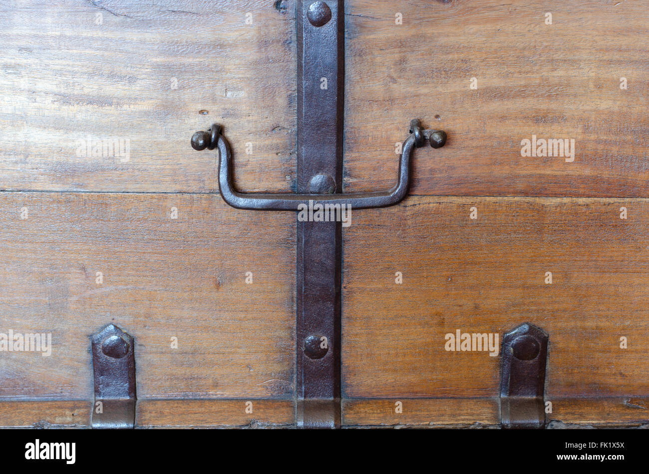 Metal handle on an old wooden chest Stock Photo