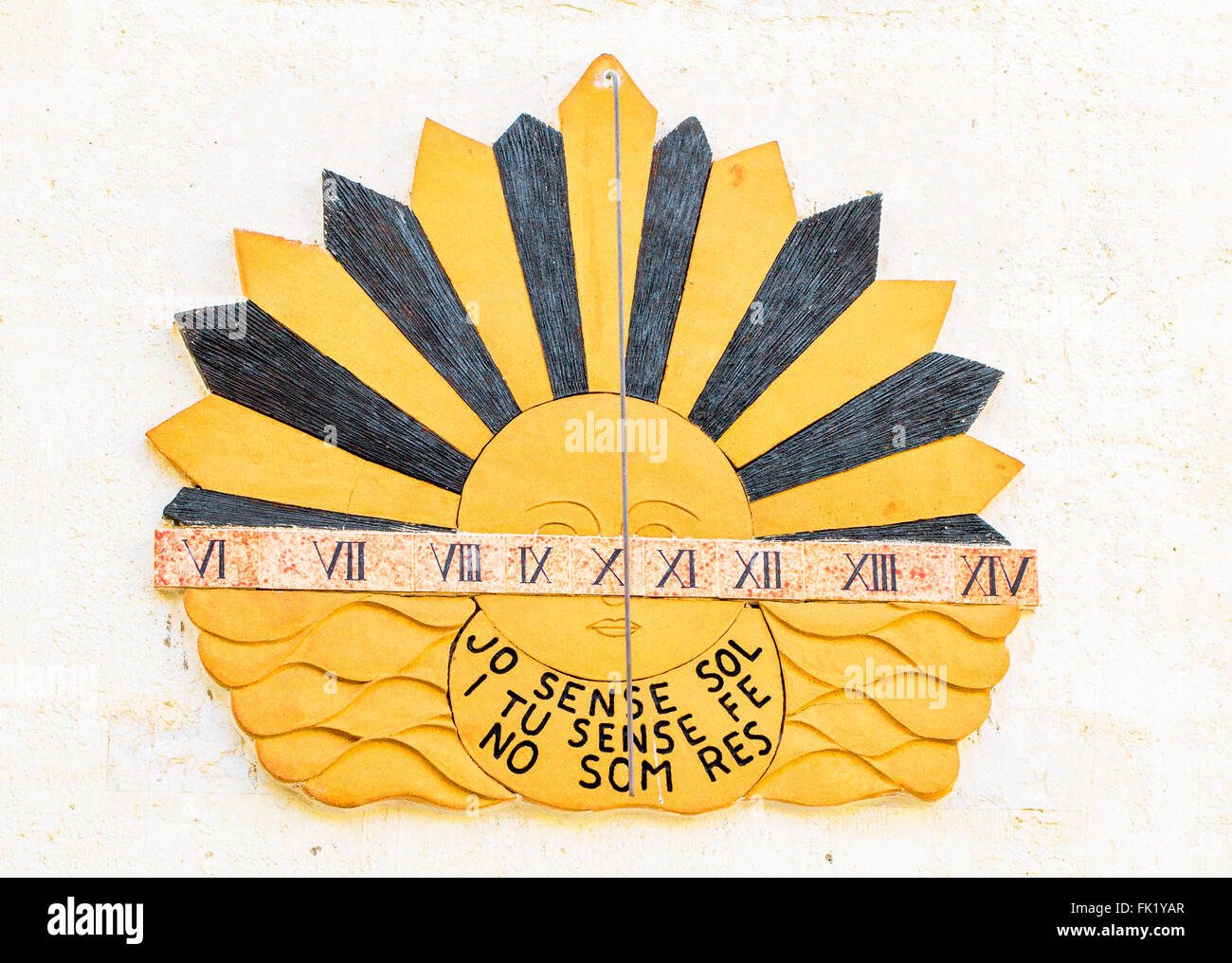 Sundial clock on old house wall in Calpe, Alicante, Spain. Translation