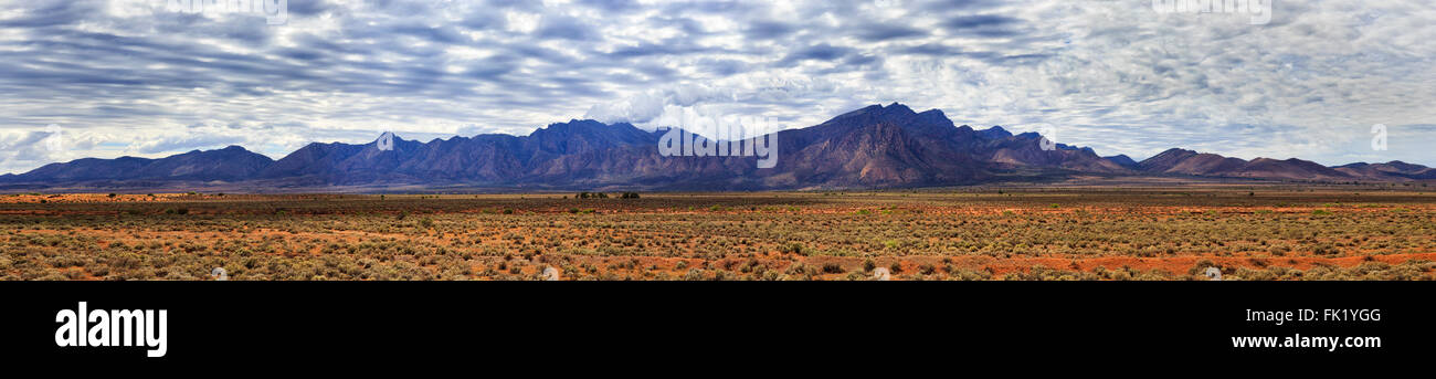 wide horizontal panorama of WIlpena Pound outer ring in Flinders Ranges national park. Landmark mountain formation of SA Stock Photo