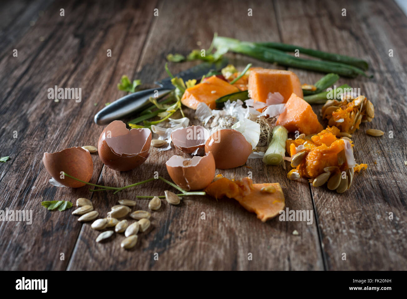 Organic leftovers, waste from vegetable ready for recycling and to compost. Collecting food leftovers for composting. Stock Photo
