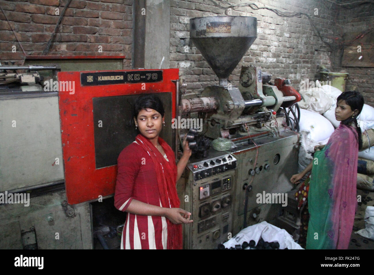 Dhaka, Bangladesh. 5 March 2016. Bangladeshi girls are working at a
