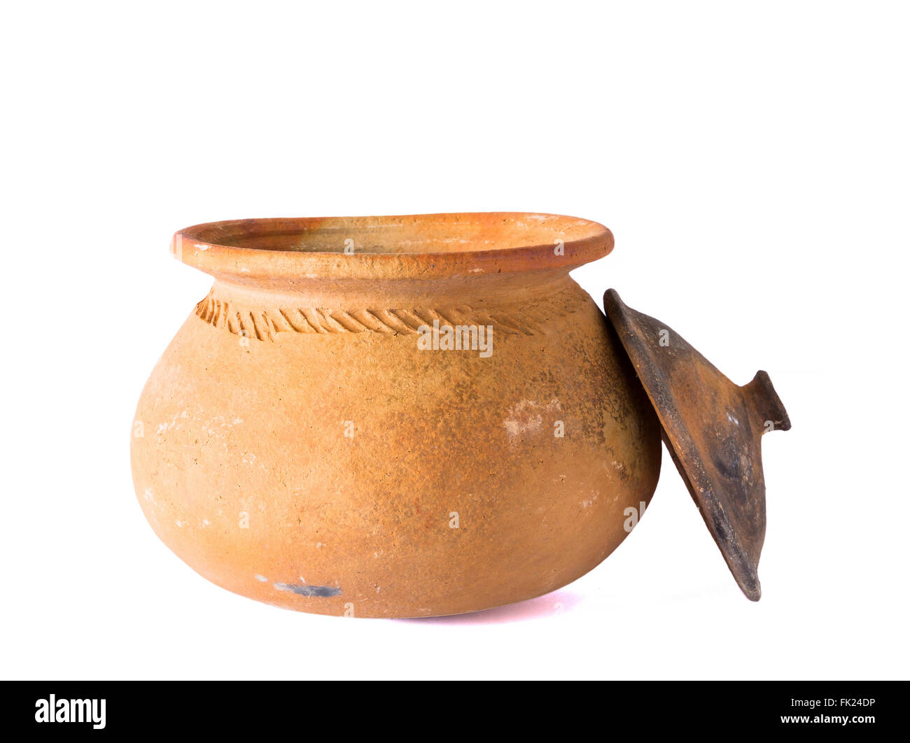 Pots made of traditional clay for use in the kitchen. On a white