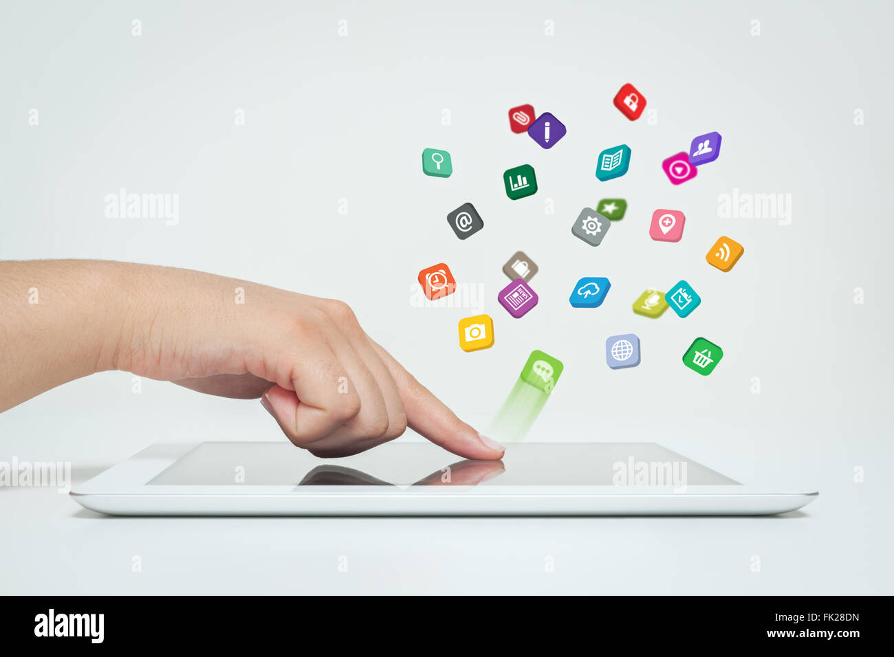 application icons fly off the tablet computer in hand Stock Photo
