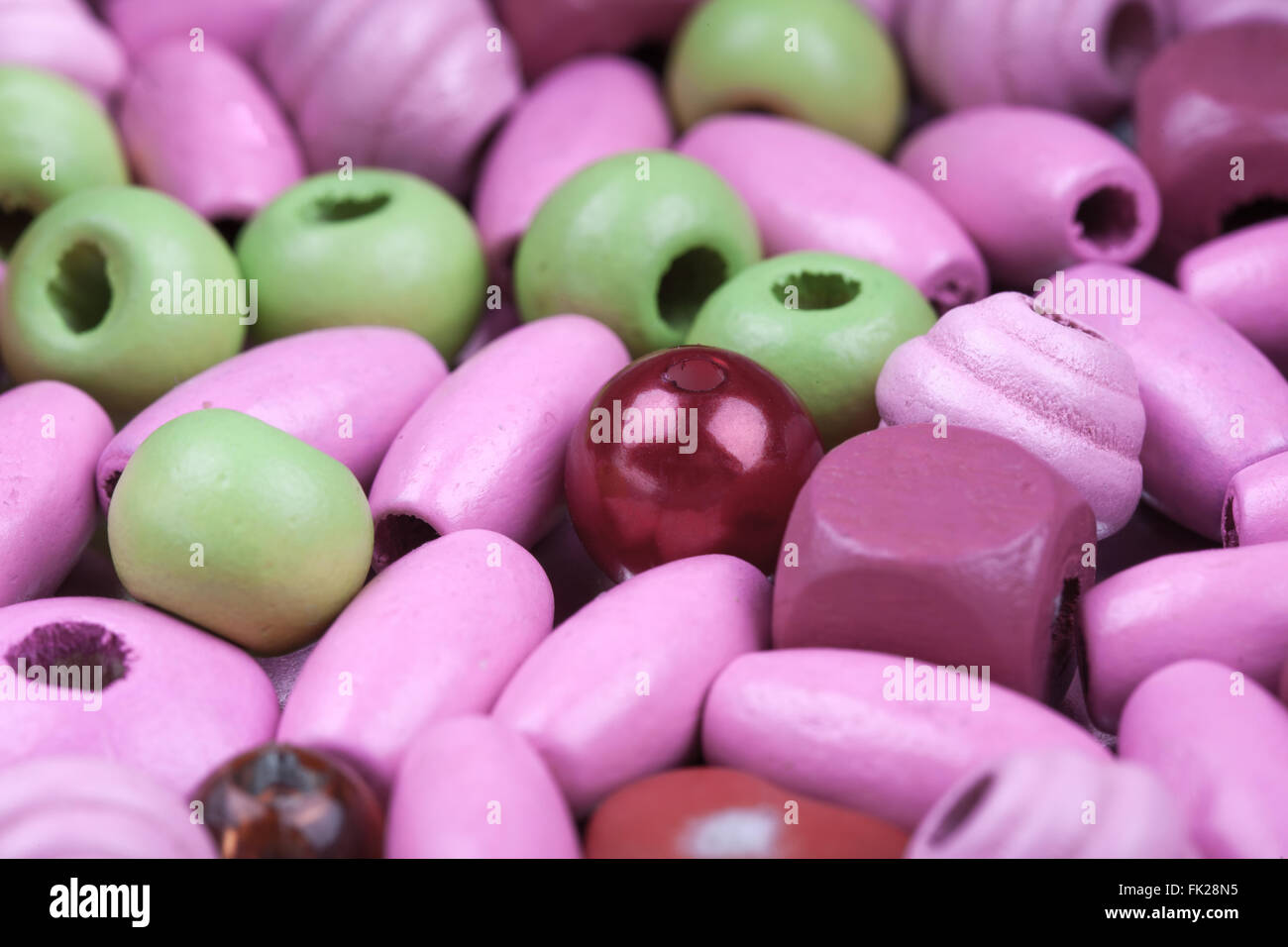 abstract macro background of pink and green toy beads Stock Photo