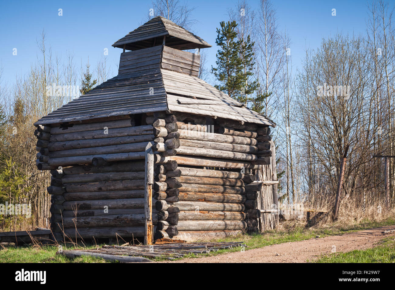 Old abandoned wooden barn, Russian village landscape in spring Stock Photo