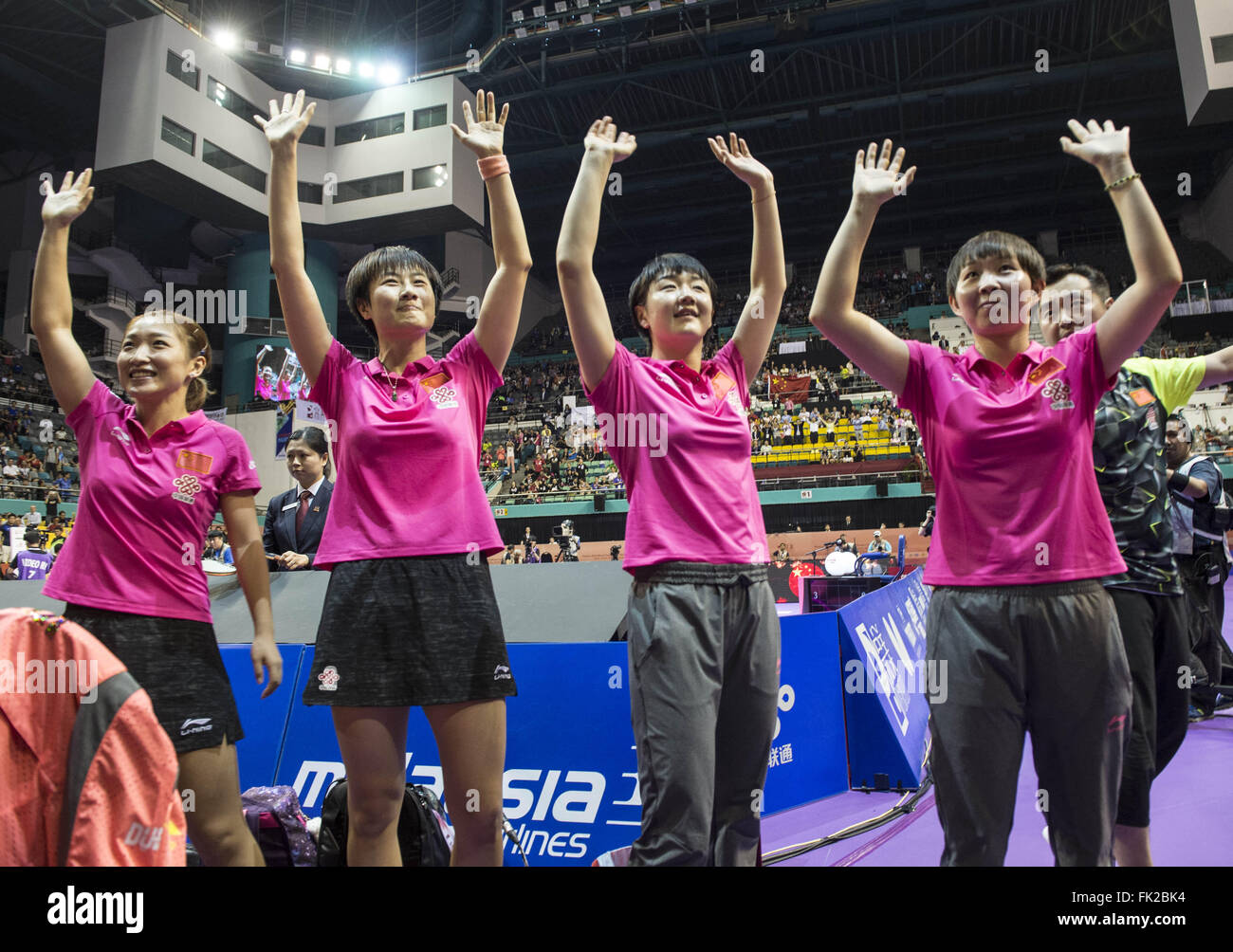 Kuala Lumpur, Malaysia. 6th Mar, 2016. (L to R)Liu Shiwen, Ding Ning, Chen Meng, Zhu Yuling and coach Kong Linghui of China's women's table tennis team celebrate with spectators after winning the final against Japan at the 2016 World Team Championships in Kuala Lumpur, Malaysia, March 6, 2016. Defending champion China's women's table tennis team won the world championship title for the 20th time by defeating Japan 3-0 in the final. © Lui Siu Wai/Xinhua/Alamy Live News Stock Photo