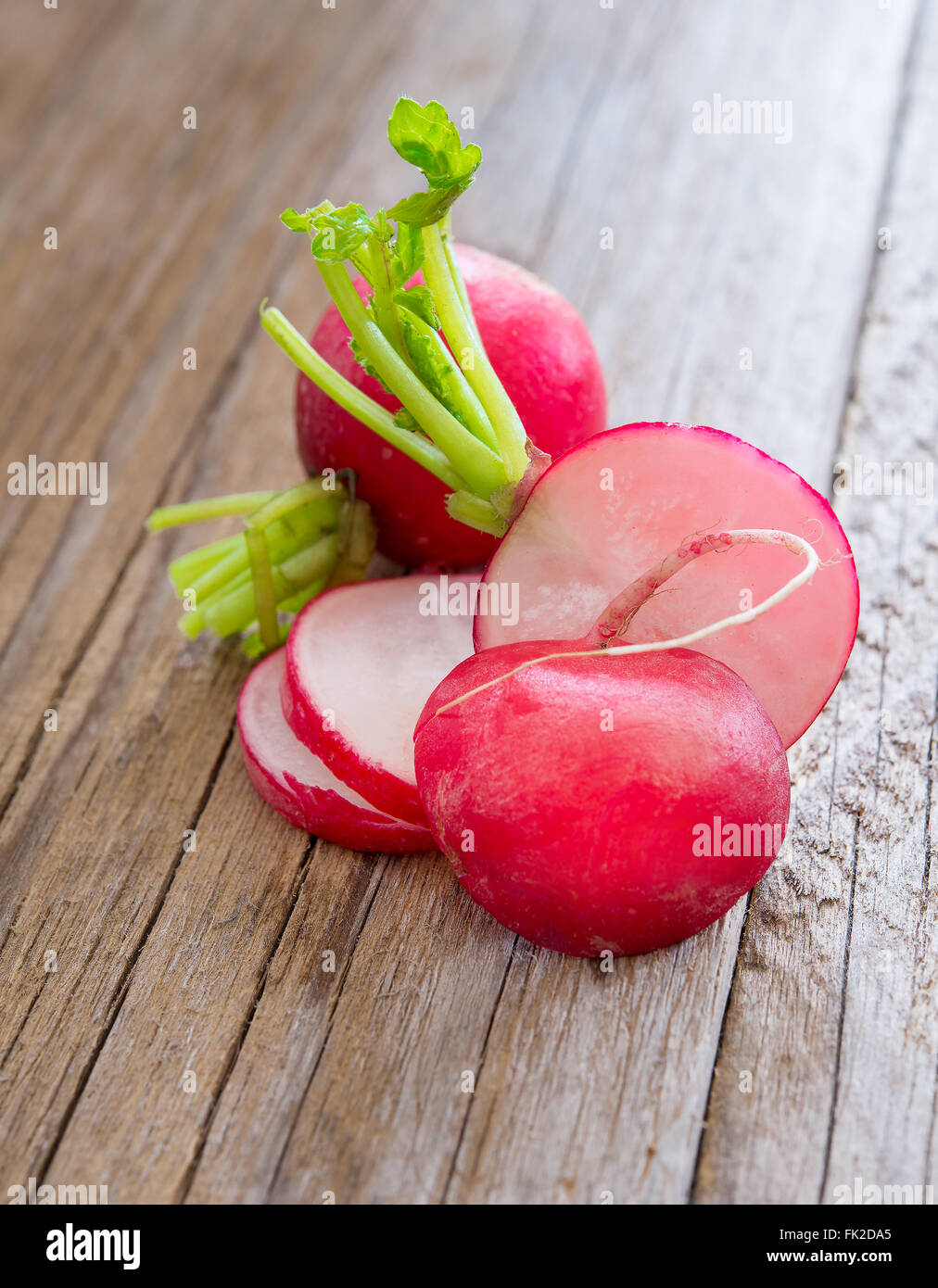 fresh sliced radish on wooden table Stock Photo Alamy