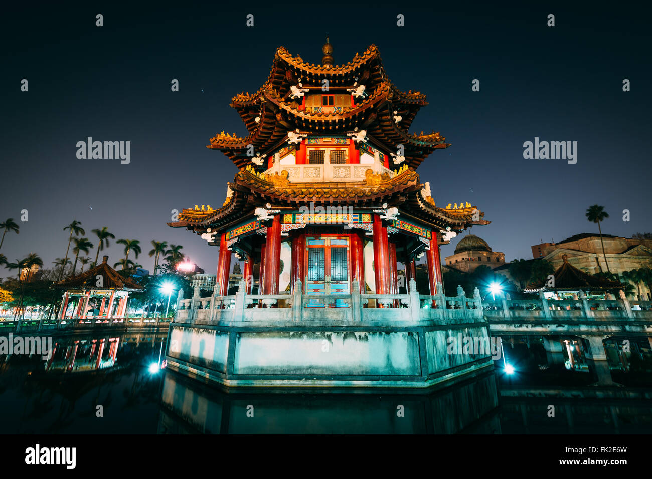 Traditional Chinese building and pond at night, at 2/28 Peace Park, in Taipei, Taiwan. Stock Photo