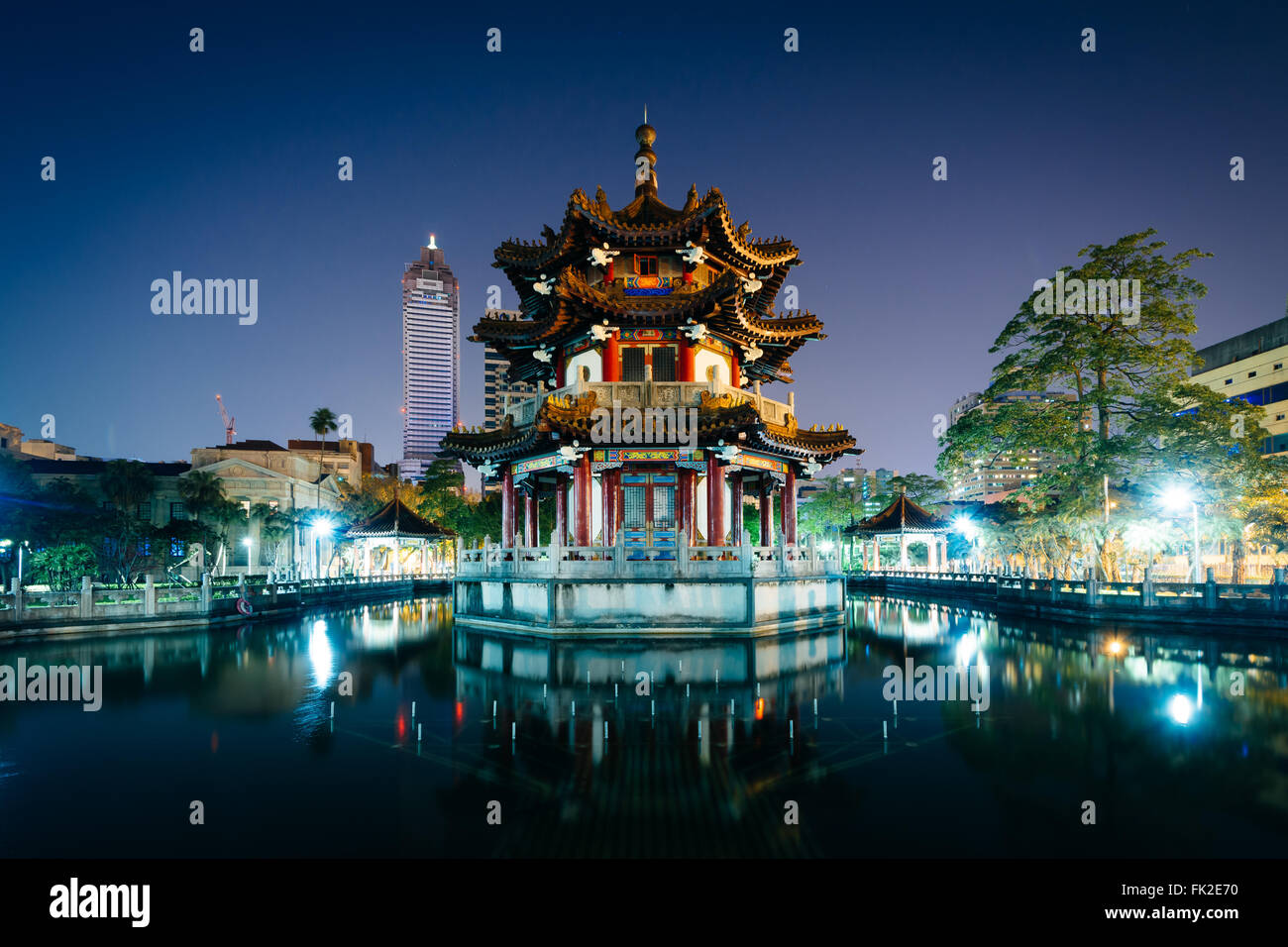 Traditional Chinese building and pond at night, at 2/28 Peace Park, in Taipei, Taiwan. Stock Photo