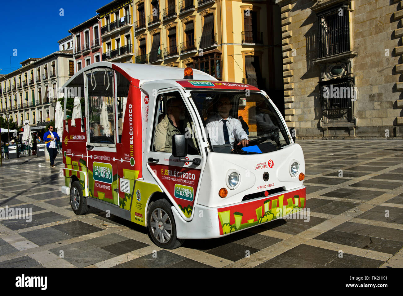 Environmentally friendly electric bus in the centre of Granada, Spain Stock Photo