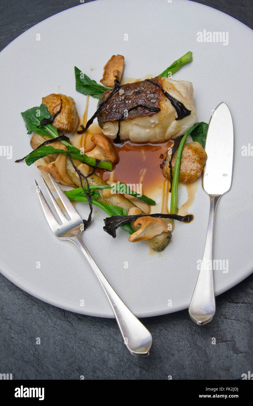 Roast cod, confit of chicken wings, chicken juices salsify and woodruff ...