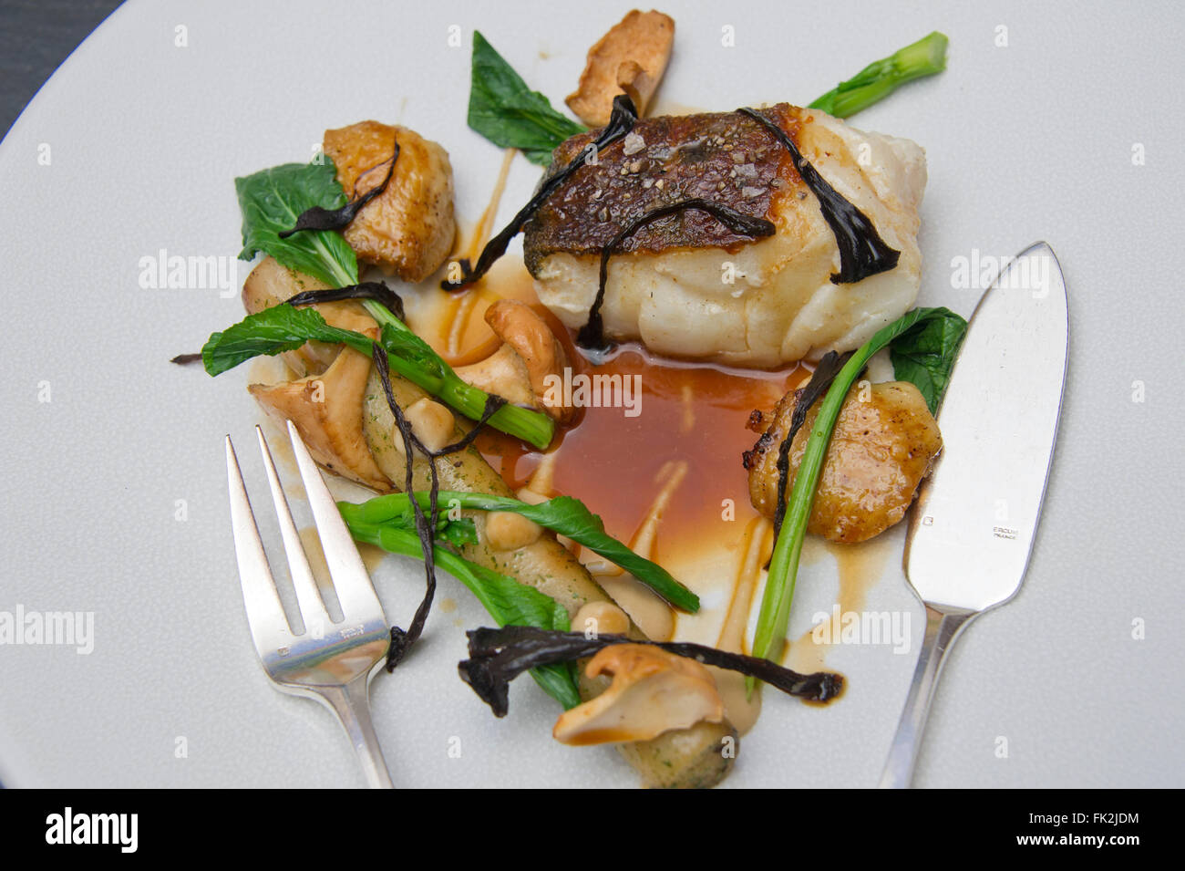 Roast cod, confit of chicken wings, chicken juices salsify and woodruff ...
