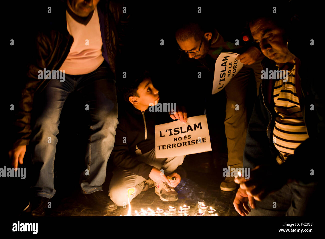Muslims pay tribute to the victims of Paris Attacks in Barcelona. Banner reading Islam Is Not Terrorism. Stock Photo