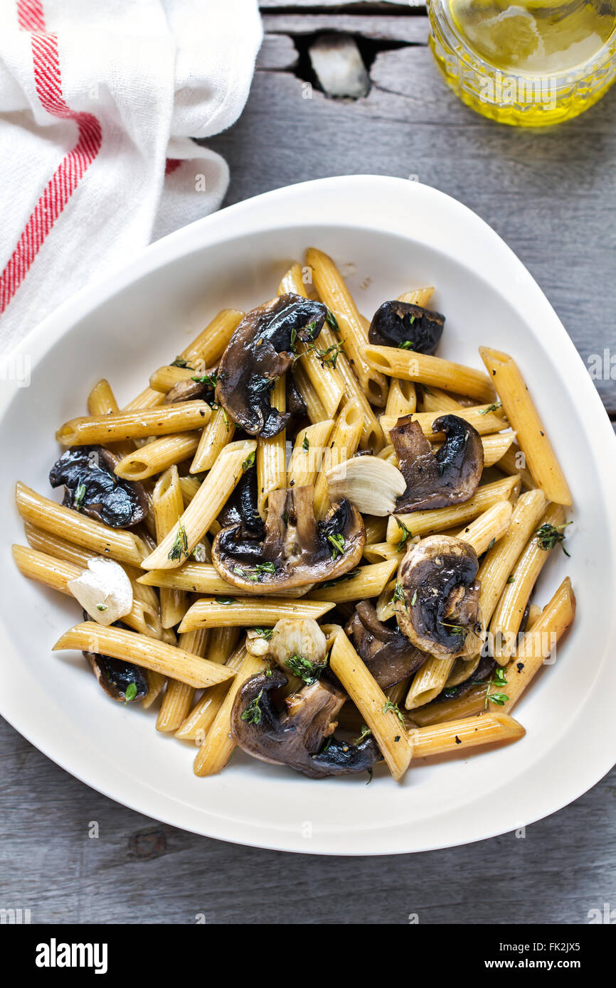 Penne with button mushroom and herb sauce Stock Photo