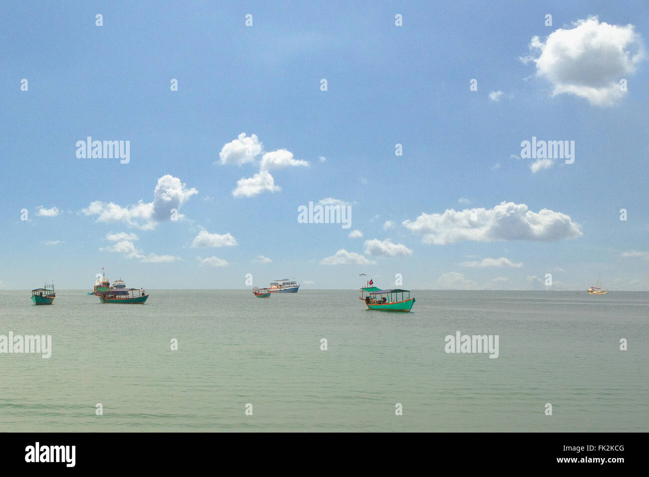 beautiful ocean, boats and blue sky with clouds Stock Photo - Alamy
