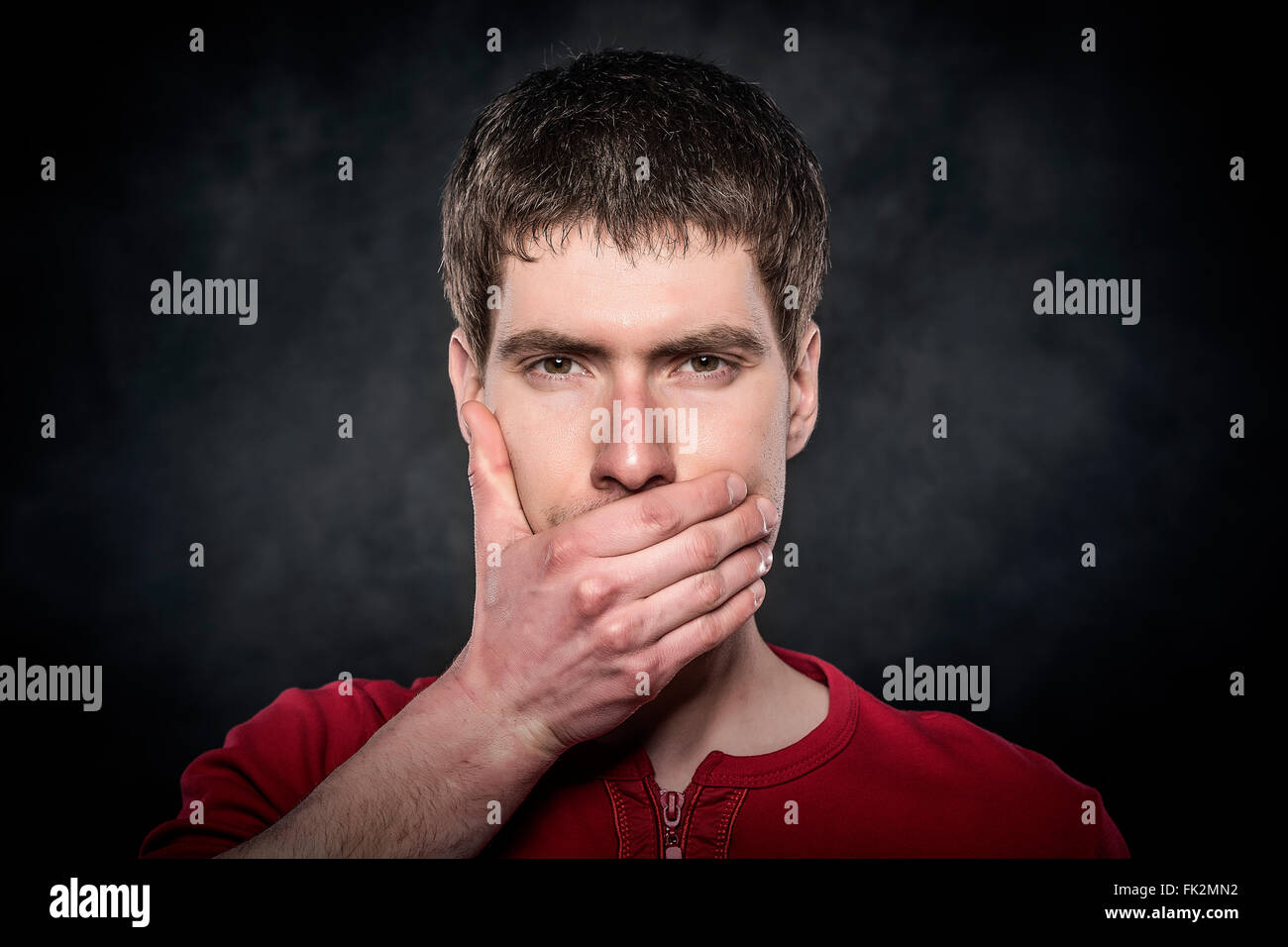 Mouth covered with hand hires stock photography and images Alamy