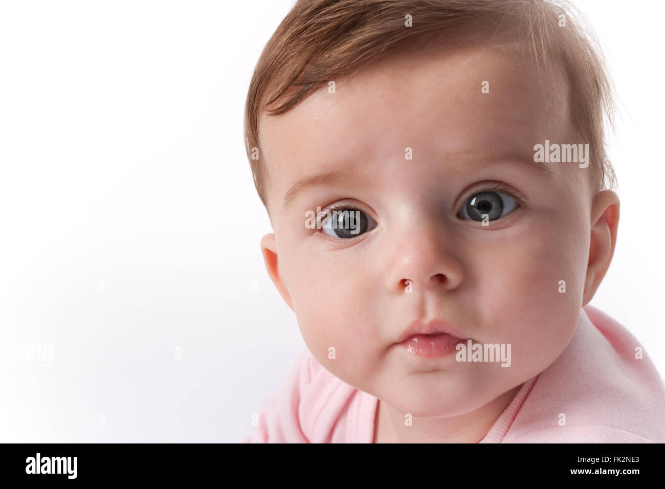 Portrait Of A Surprised Baby Girl On White Background on white ...