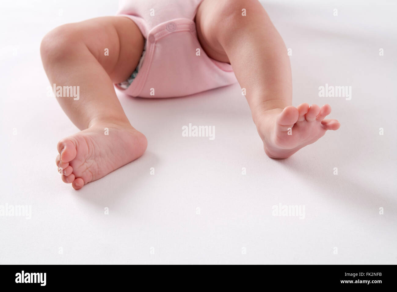 Baby legs on white background Stock Photo
