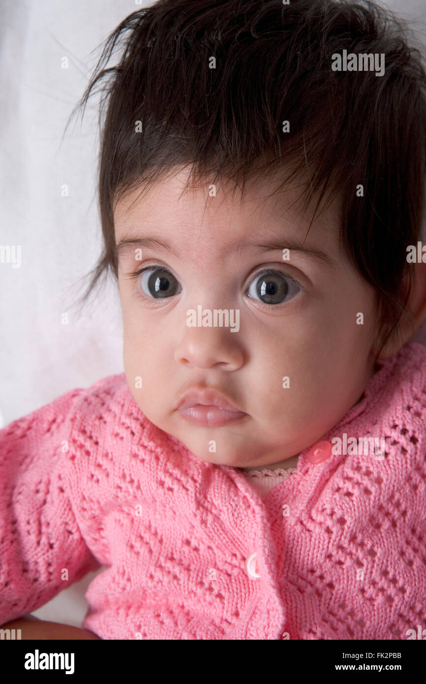Portrait Of A Baby Girl with large eyes Stock Photo